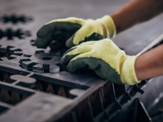 Close up of an engineer forming a metal component