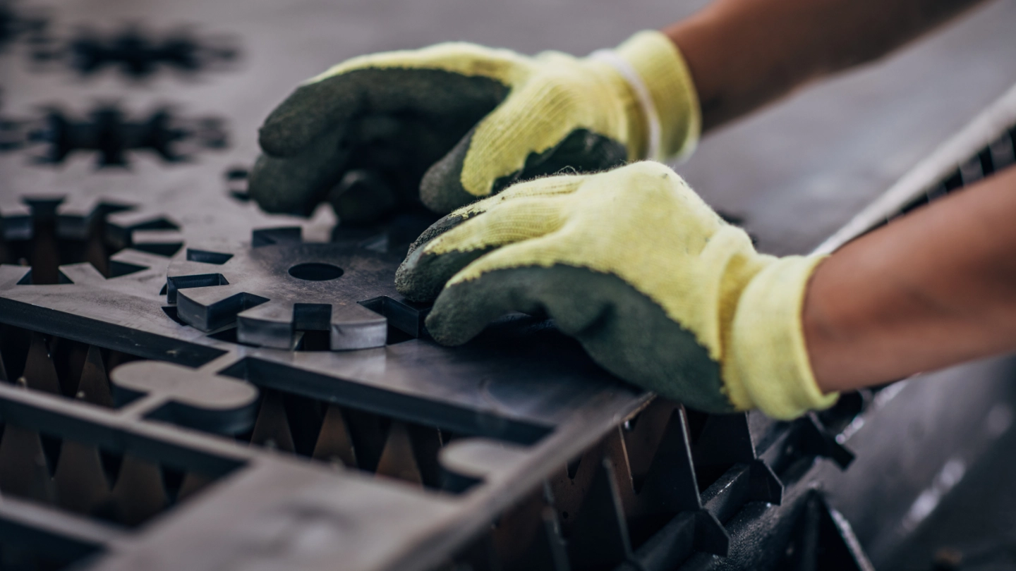 Close up of an engineer forming a metal component