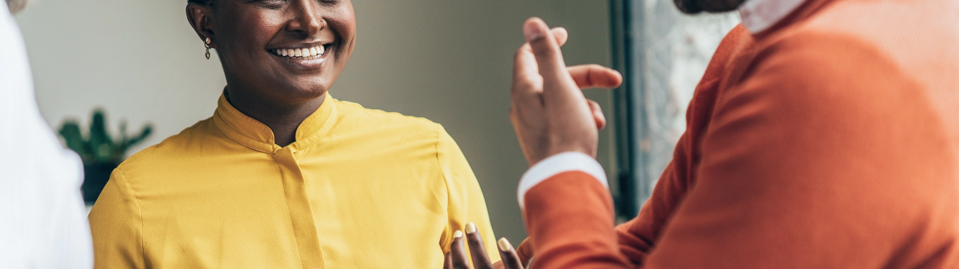 Woman and two men talking