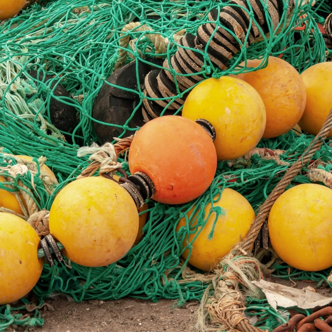 A pile of fishing nets and buoys